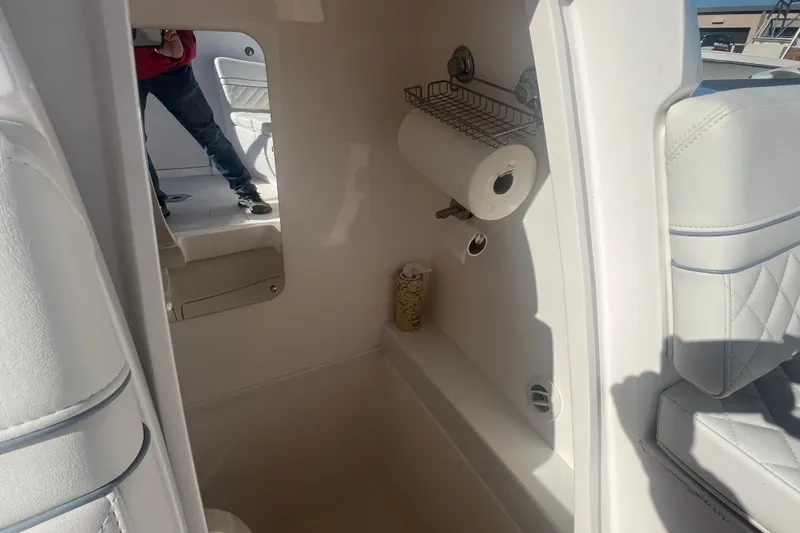 Slide: The Image of 2022 Intrepid 327-I CC interior with storage and seating. - 23