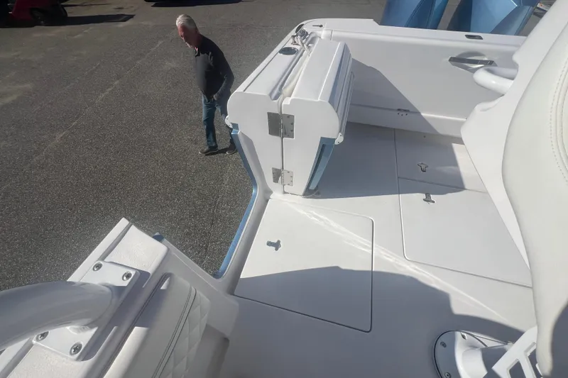 Slide: The Image of 2022 Intrepid 327-I CC boat deck with seating and storage compartments. - 42