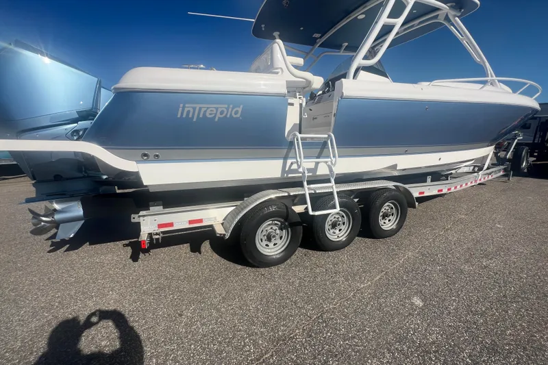 Slide: The Image of 2022 Intrepid 327-I CC boat on trailer, side view, sunny day. - 44