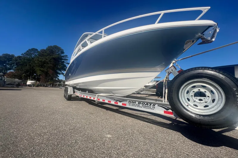 Slide: The Image of 2022 Intrepid 327-I CC boat on trailer under clear blue sky. - 47