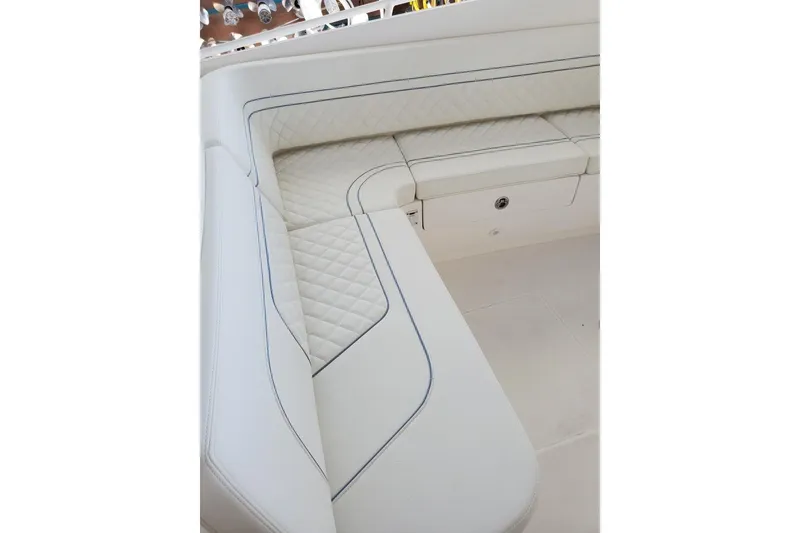 Slide: The Image of 2022 Intrepid 327-I CC boat with dual outboard motors on a trailer. - 5