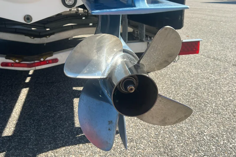 Slide: The Image of Close-up of a 2022 Intrepid 327-I CC boat propeller on a trailer. - 54