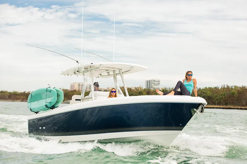 Slide: The Image of 2022 Intrepid 327-I CC boat interior with seating and rod holders. - 8