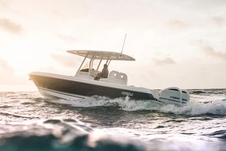 Slide: The Image of 2022 Intrepid 327-I CC boat seat with diamond-stitched white upholstery. - 9