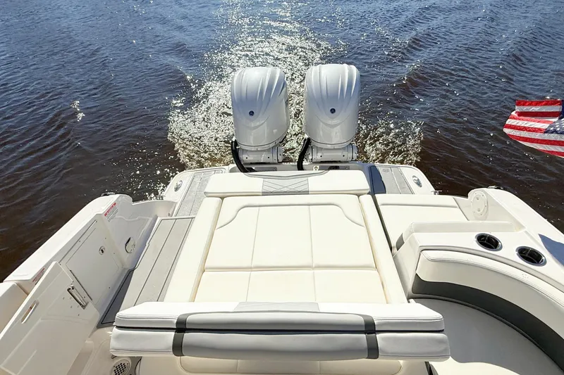 Slide: The Image of Cockpit controls of 2025 Chaparral 280 OSX boat, featuring advanced navigation and throttle systems. - 17