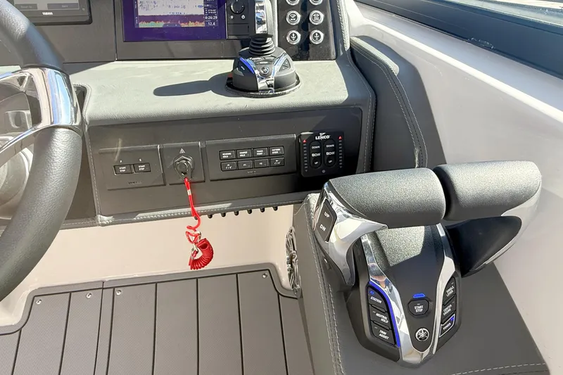 Slide: The Image of Cockpit of 2025 Chaparral 280 OSX boat with advanced navigation displays and controls. - 19