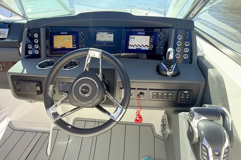 Slide: The Image of Control panel of 2025 Chaparral 280 OSX boat with Yamaha joystick and Lenco trim tabs. - 20