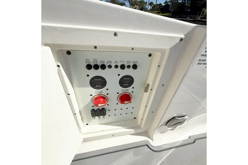 Slide: The Image of 2025 Chaparral 280 OSX boat interior with sleek cabinetry and modern speaker system. - 24