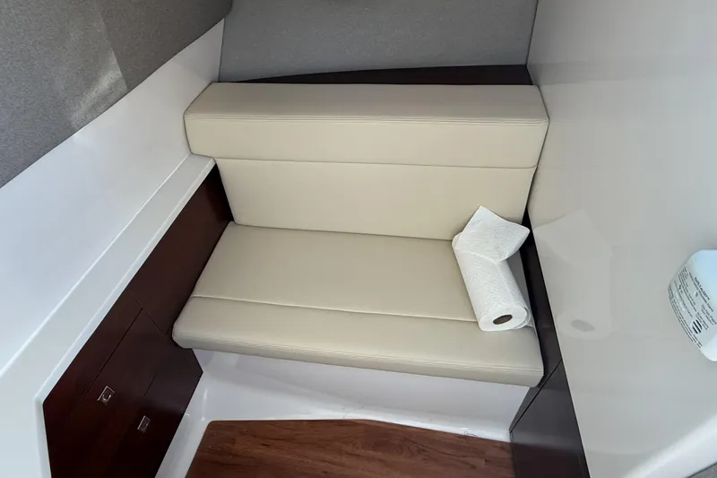 Slide: The Image of Interior cabin of 2025 Chaparral 280 OSX boat with seating and sink. - 27