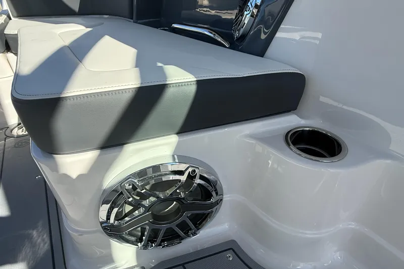 Slide: The Image of 2025 Chaparral 280 OSX boat interior with sink and countertop, featuring sleek design elements. - 30