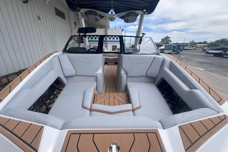 Slide: The Image of 2025 Nautique Super Air Nautique G23 interior with luxurious seating and modern design. - 8