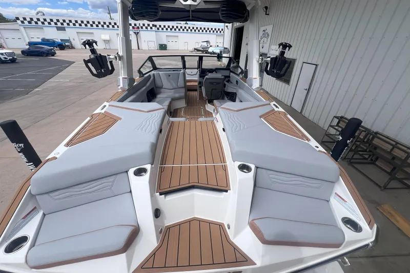 Slide: The Image of 2025 Nautique Super Air Nautique G23 boat with sleek interior and spacious seating. - 9