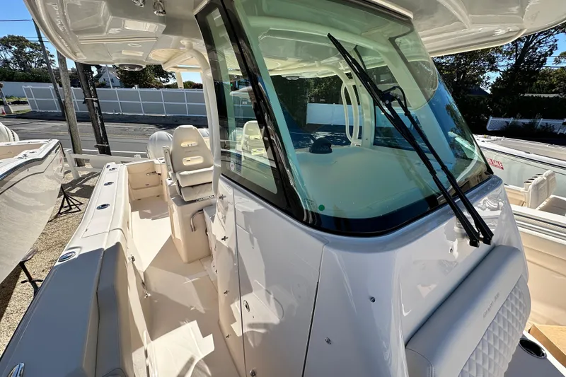 Slide: The Image of 2026 Grady-White Canyon 306 boat with sleek design and spacious seating area. - 21