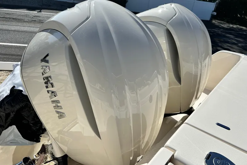 Slide: The Image of 2026 Grady-White Canyon 306 with dual Yamaha outboard engines, close-up view. - 9