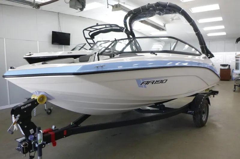 Slide: The Image of 2026 Yamaha Boats AR190 on trailer in showroom, sleek design, modern features. - 1
