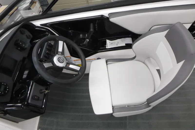 Slide: The Image of 2026 Yamaha AR190 boat cockpit with steering wheel and modern seating. - 6