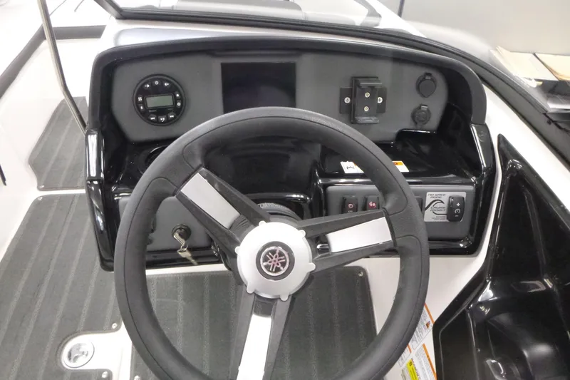 Slide: The Image of 2026 Yamaha Boats AR190 dashboard with steering wheel and control panel. - 7