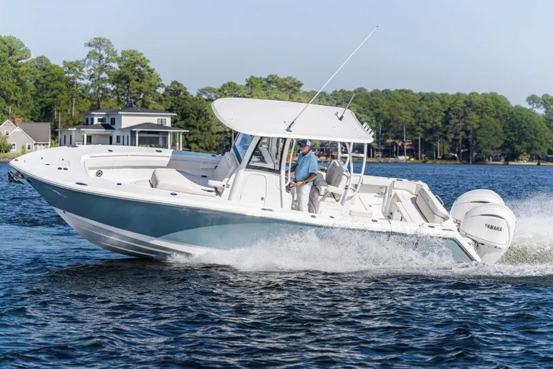 The Image of 2026 Sea Hunt Ultra 285 Coffin Box boat with people enjoying a day on the water. - 0