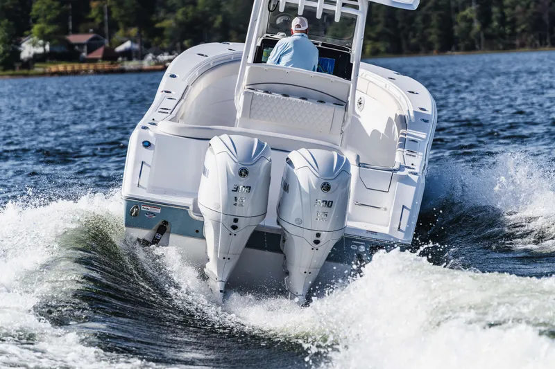 Slide: The Image of 2026 Sea Hunt Ultra 285 Coffin Box cruising on a lake with dual engines. - 20