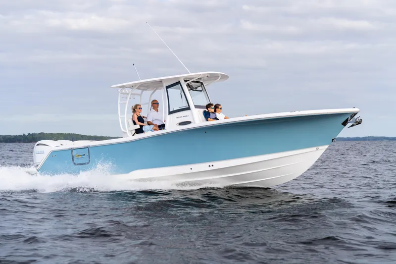 Slide: The Image of 2026 Sea Hunt Ultra 285 Coffin Box cruising on open water with passengers. - 32