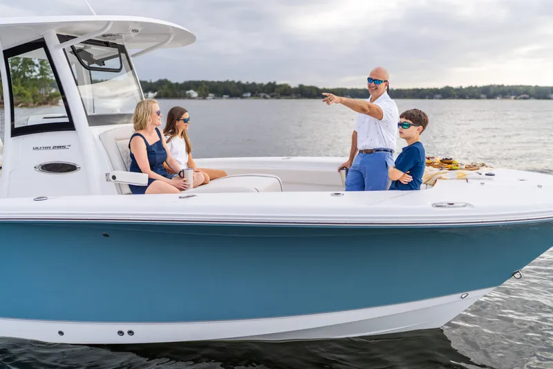 Slide: The Image of Family enjoying a day on the 2026 Sea Hunt Ultra 285 Coffin Box boat. - 33