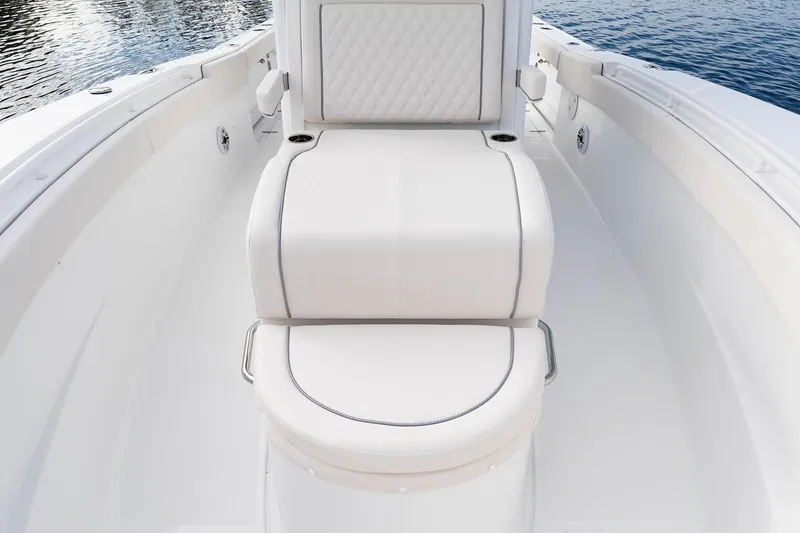Slide: The Image of 2026 Sea Hunt Ultra 285 Coffin Box with open storage compartment on deck. - 7
