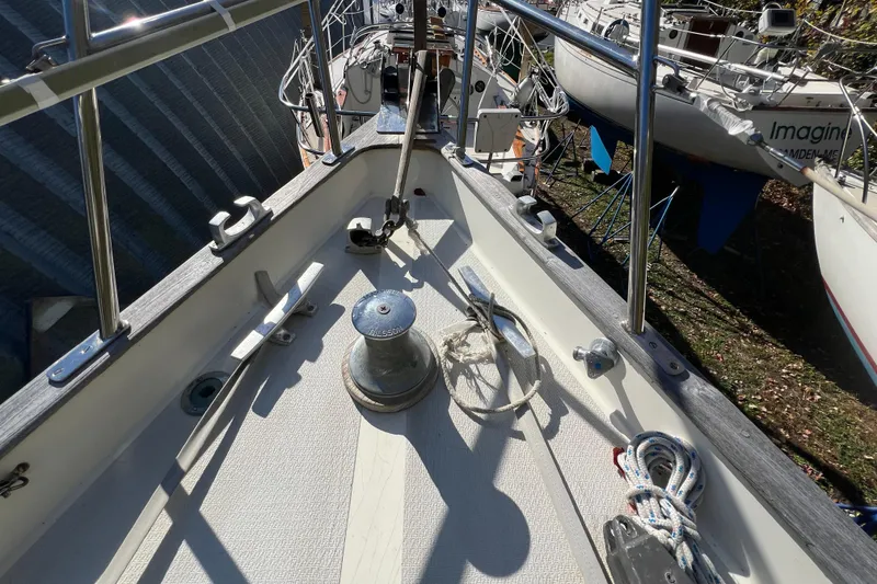 Slide: The Image of Deck of 1986 Victoria 34 Sloop with winch and ropes, docked in a boatyard. - 17