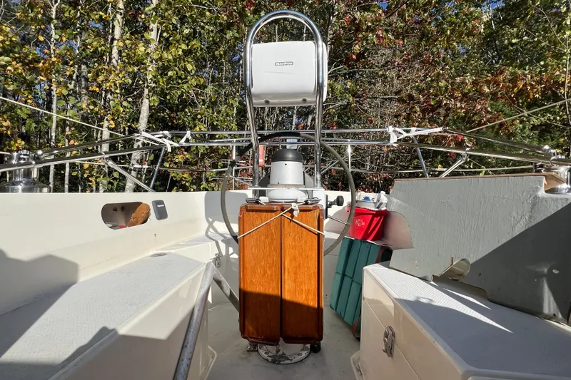 Slide: The Image of Cockpit of 1986 Victoria 34 Sloop sailboat with wooded backdrop. - 18