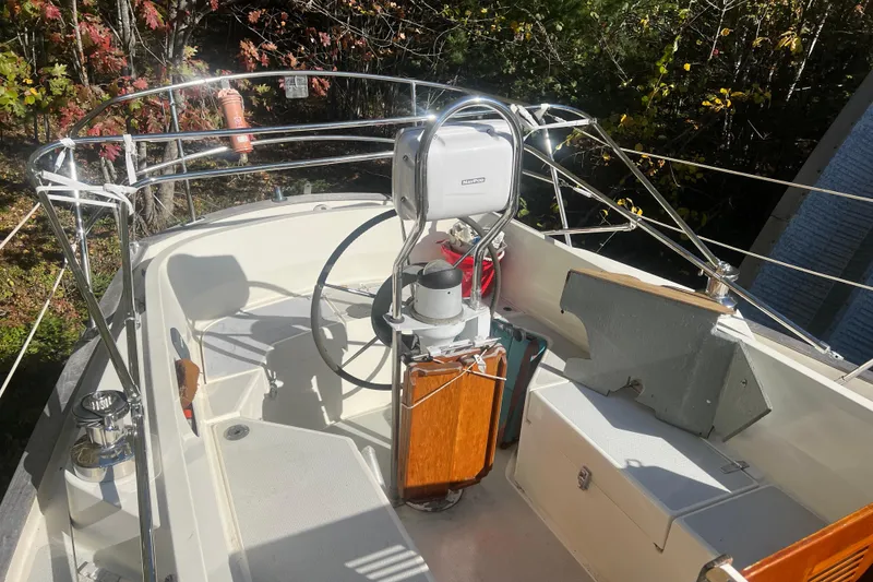 Slide: The Image of Cockpit of 1986 Victoria 34 Sloop with steering wheel and navigation equipment. - 21