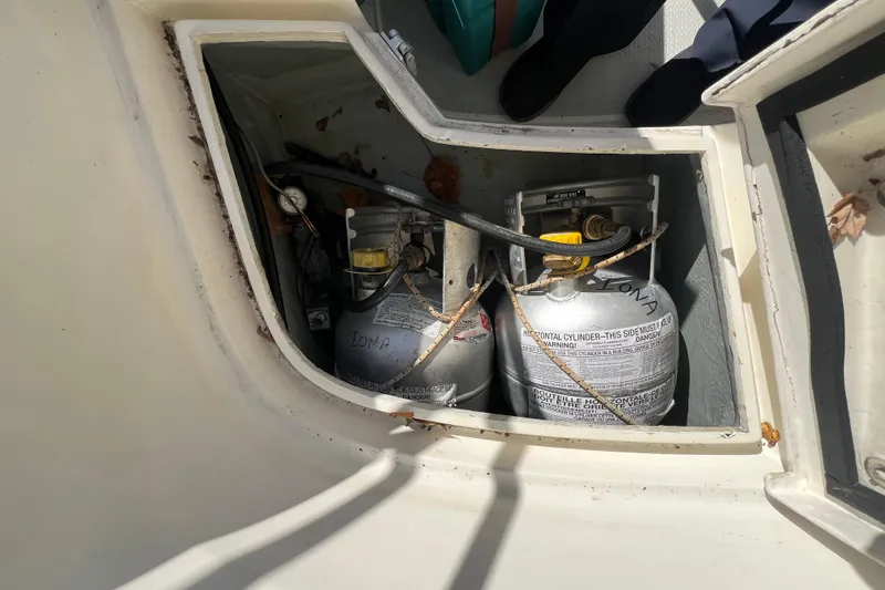 Slide: The Image of Propane storage compartment on a 1986 Victoria 34 Sloop sailboat. - 24