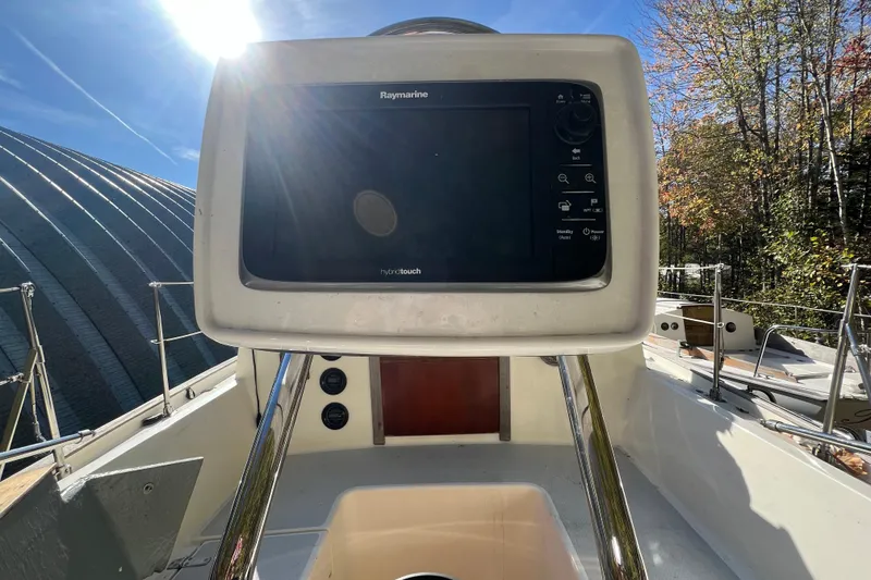 Slide: The Image of Cockpit of 1986 Victoria 34 Sloop with Raymarine navigation system under bright sunlight. - 25