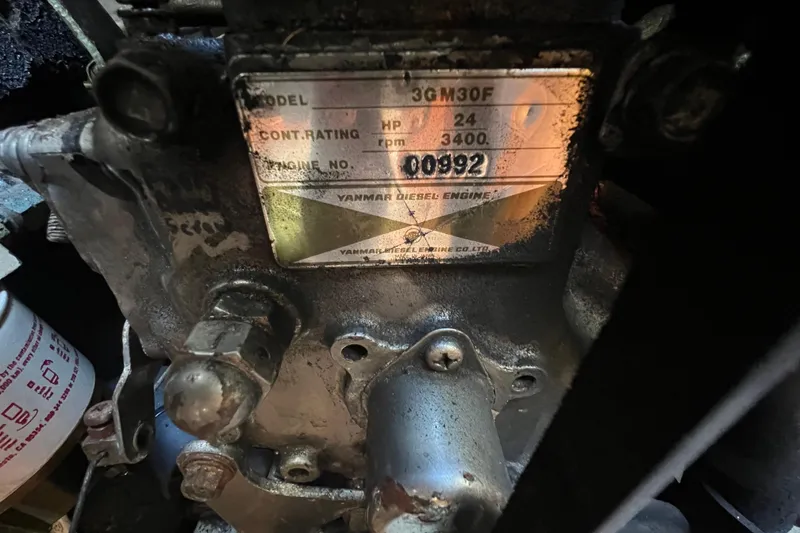 Slide: The Image of Close-up of a Yanmar diesel engine plate on a 1986 Victoria 34 Sloop. - 28