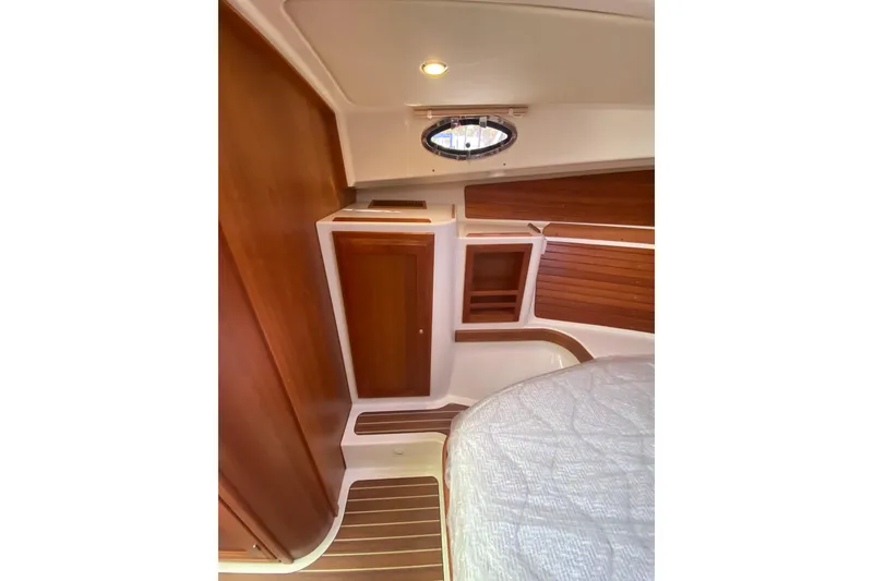 Slide: The Image of Helm of 2022 Back Cove 34O boat with navigation equipment and wooden steering wheel. - 15