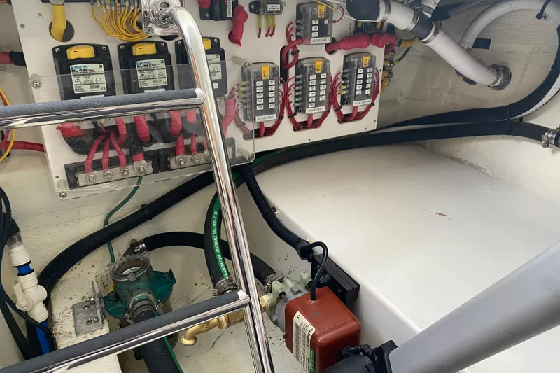 Slide: The Image of 2022 Back Cove 34O cabin interior with wood paneling and cozy bed. - 23