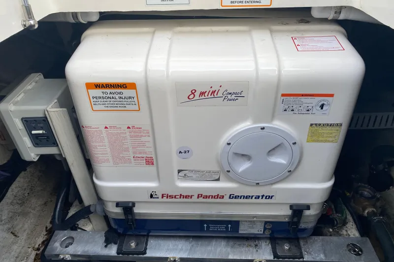Slide: The Image of Fischer Panda generator in a 2022 Back Cove 34O boat, featuring compact power design. - 30