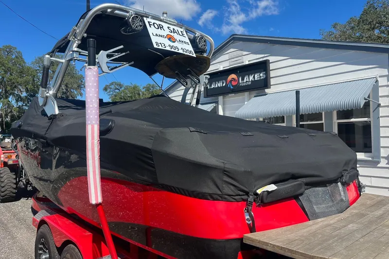 Slide: The Image of 2017 MasterCraft X23 boat for sale at Land O' Lakes Marine, covered and parked outside. - 2