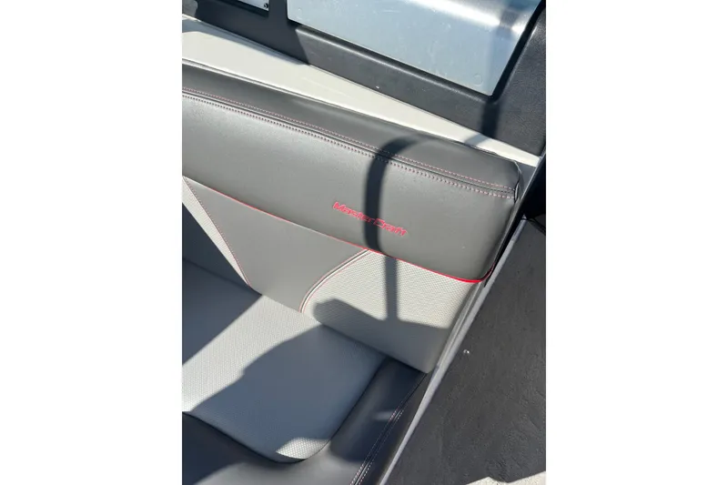 Slide: The Image of 2017 MasterCraft X23 boat seat with gray and red stitching detail. - 3