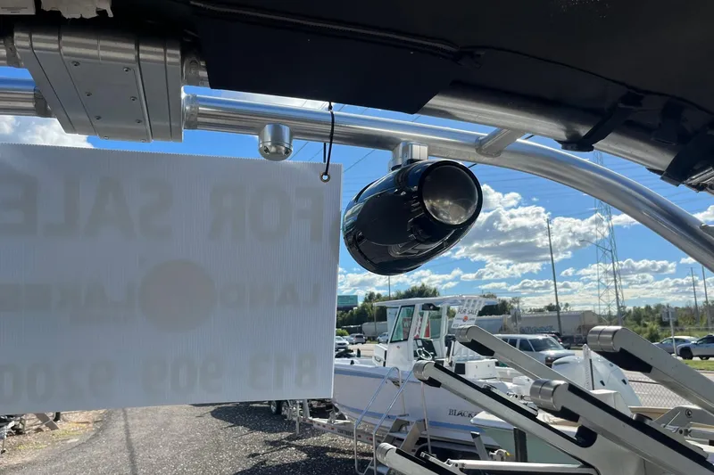 Slide: The Image of 2017 MasterCraft X23 boat with speaker and sale sign, sunny day background. - 5