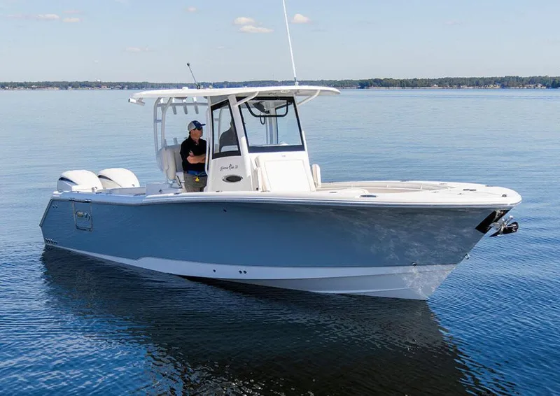 The Image of Manufacturer Provided Image: 2026 Sea Hunt Gamefish 28 Coffin Box boat on calm water, featuring dual engines. - 0