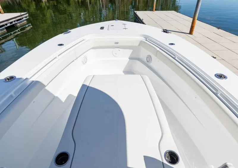 Slide: The Image of Manufacturer Provided Image: 2026 Sea Hunt Gamefish 28 Coffin Box boat interior, docked on calm water. - 3