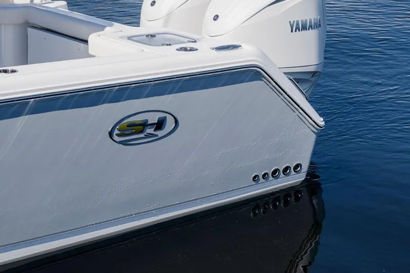 Slide: The Image of 2026 Sea Hunt Gamefish 28 Coffin Box boat with Yamaha engines on water. - 8