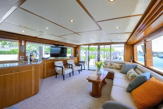 Slide: The Image of Luxurious interior of 1998 Hatteras 70 Cockpit Motor Yacht with elegant seating and large windows. - 2