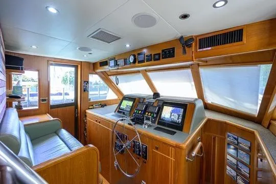 Slide: The Image of Interior of 1998 Hatteras 70 Cockpit Motor Yacht with modern navigation equipment. - 23