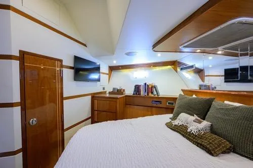 Slide: The Image of Luxurious cabin interior of 1998 Hatteras 70 Cockpit Motor Yacht with modern amenities. - 41
