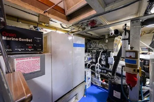 Slide: The Image of Engine room of 1998 Hatteras 70 Cockpit Motor Yacht with marine generator and equipment. - 47