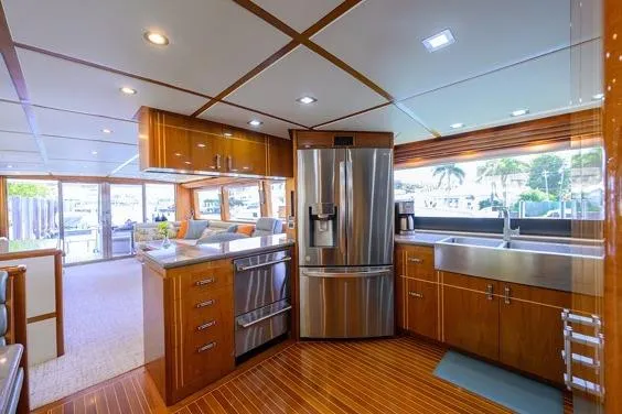 Slide: The Image of Luxurious kitchen interior of 1998 Hatteras 70 Cockpit Motor Yacht with modern appliances. - 7