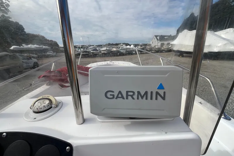 Slide: The Image of 2001 Boston Whaler 16 Dauntless with Garmin navigation system at marina. - 17