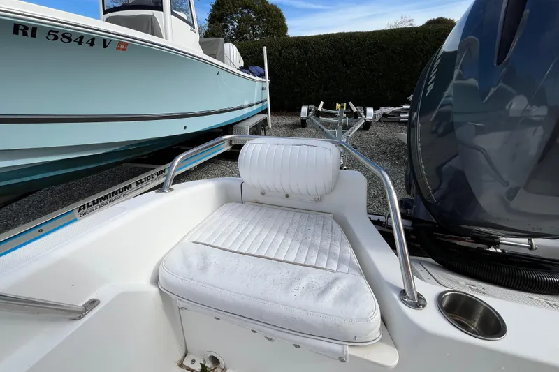 Slide: The Image of 2001 Boston Whaler 16 Dauntless boat interior with seating and motor detail. - 19