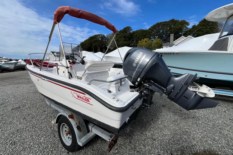 Slide: The Image of 2001 Boston Whaler 16 Dauntless boat with Yamaha outboard motor on trailer. - 2