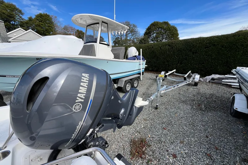 Slide: The Image of Boston Whaler 16 Dauntless 2001 with Yamaha outboard motor on trailer, parked outdoors. - 20